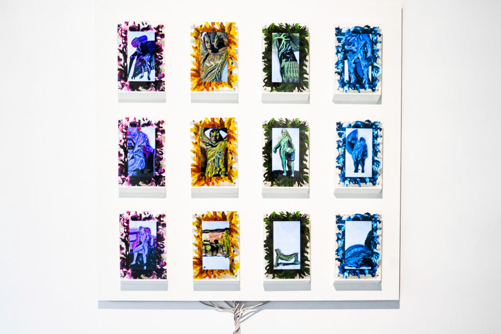 12 digital 5x7 acrylic frames play looping animated choreographies of disabled models. Rather than flesh, each body is a topography of color– tangles of tendons, pathways and branches that shift with their movements. As they move, the imprints of their former positions stay in place, creating a trail of color and texture by stacking on top of themselves, tracing the full space that the motion has occupied. These traces are echoed by printed designs on the acrylic frames themselves; each screen is surrounded by splashes of paint coordinated to the color of each performers animations: blue, yellow, pink and green.